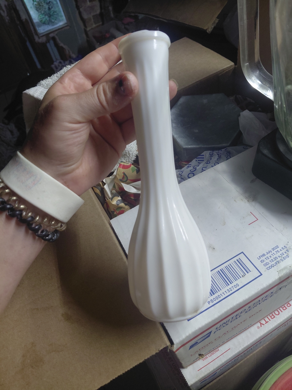 vintage white milk glass bud vase with a bulbous, ribbed lower body